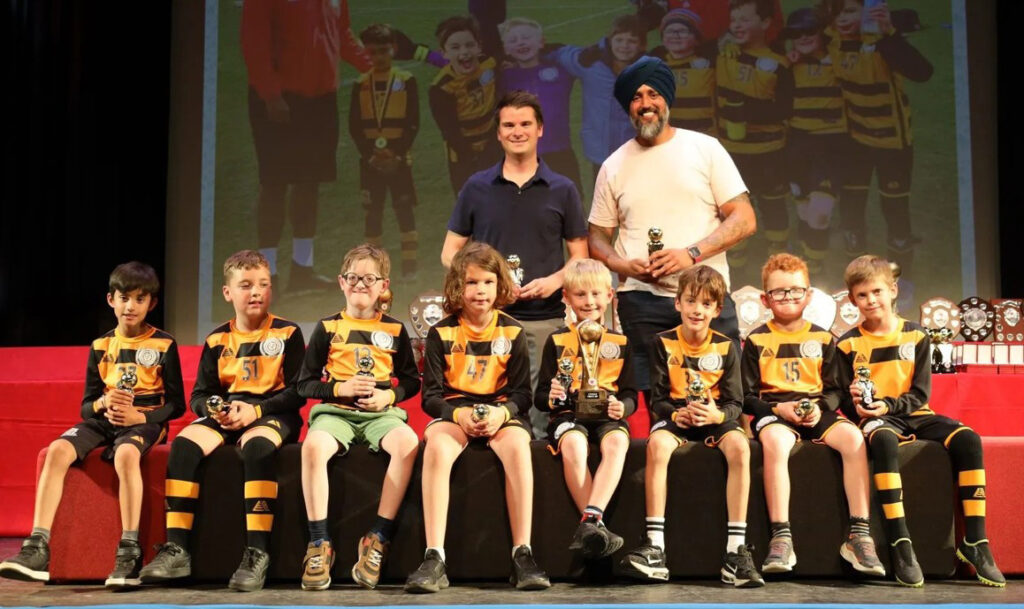 Under 8 Spitfires Fair Play Award winners on stage 2025