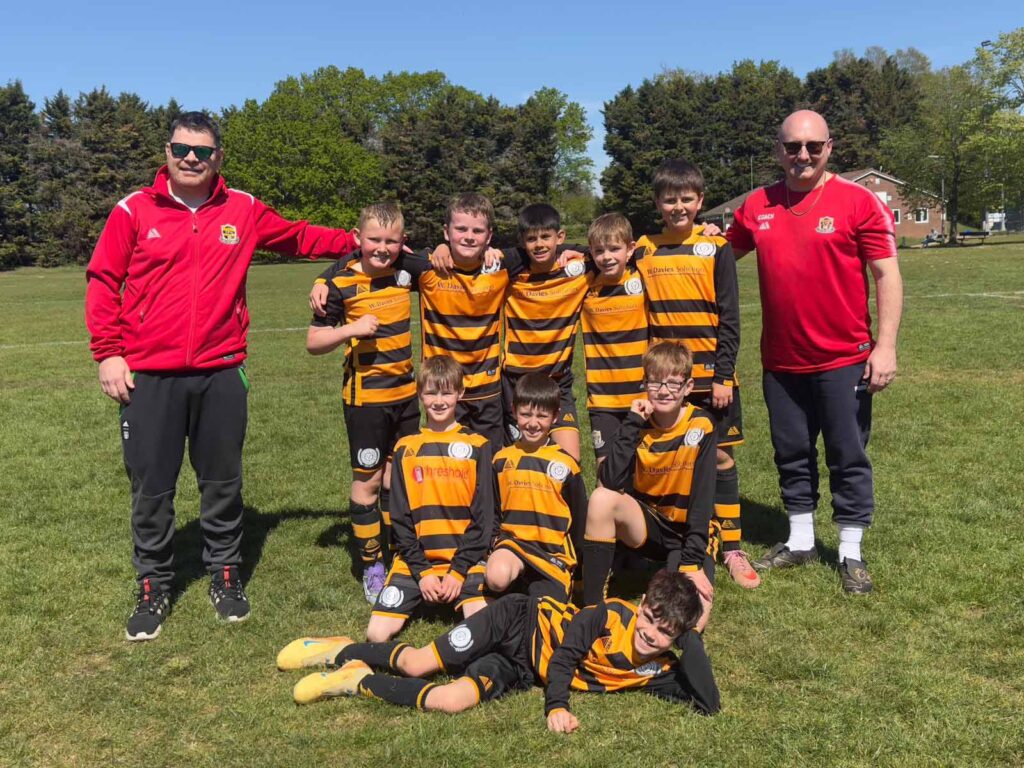 U10 Vikings Division 6 Champions team photo with coaches
