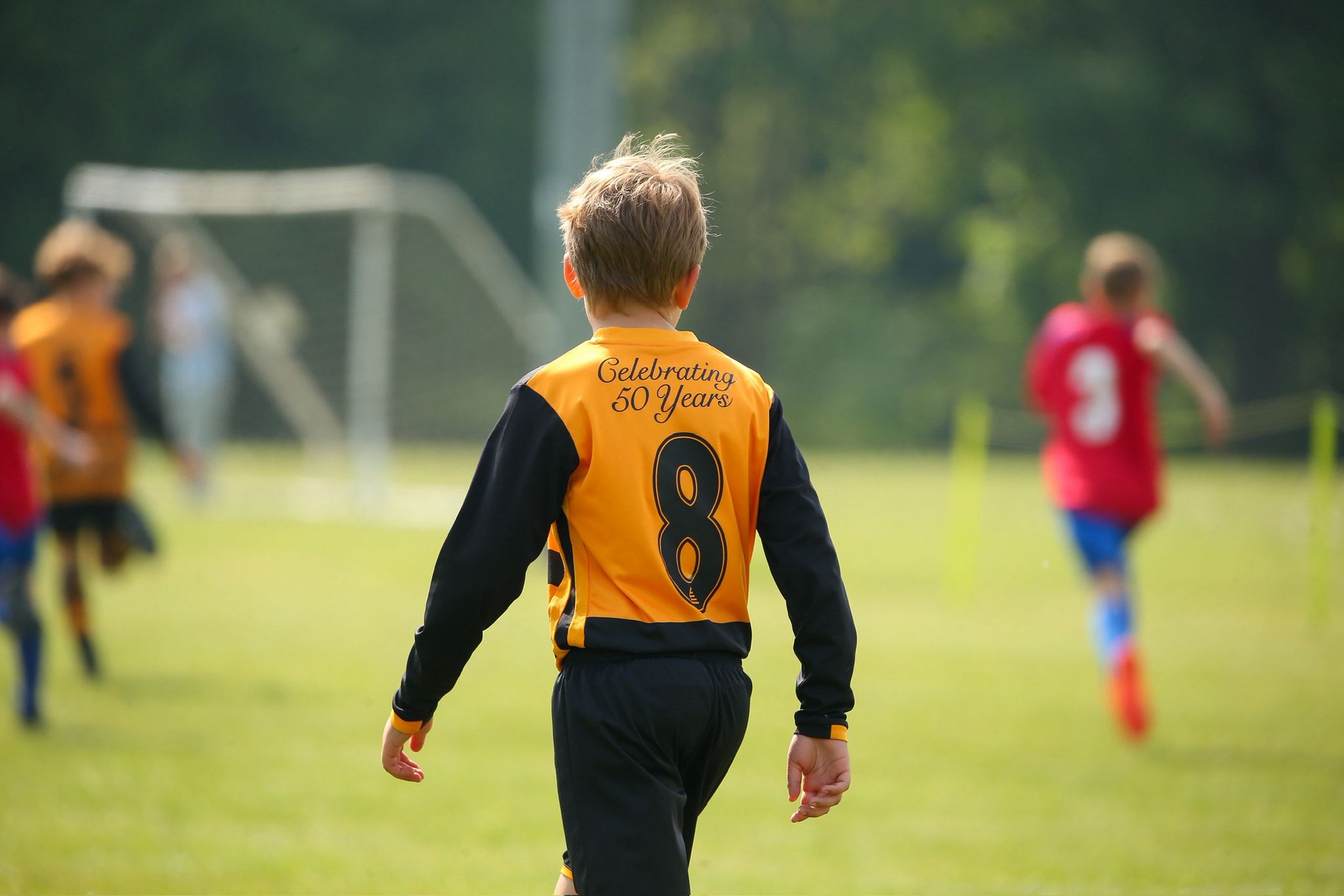 Curley Park Rangers FC youth player wearing number 8 jersey on pitch