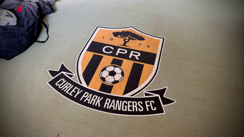 Curley Park Rangers FC club badge logo on floor
