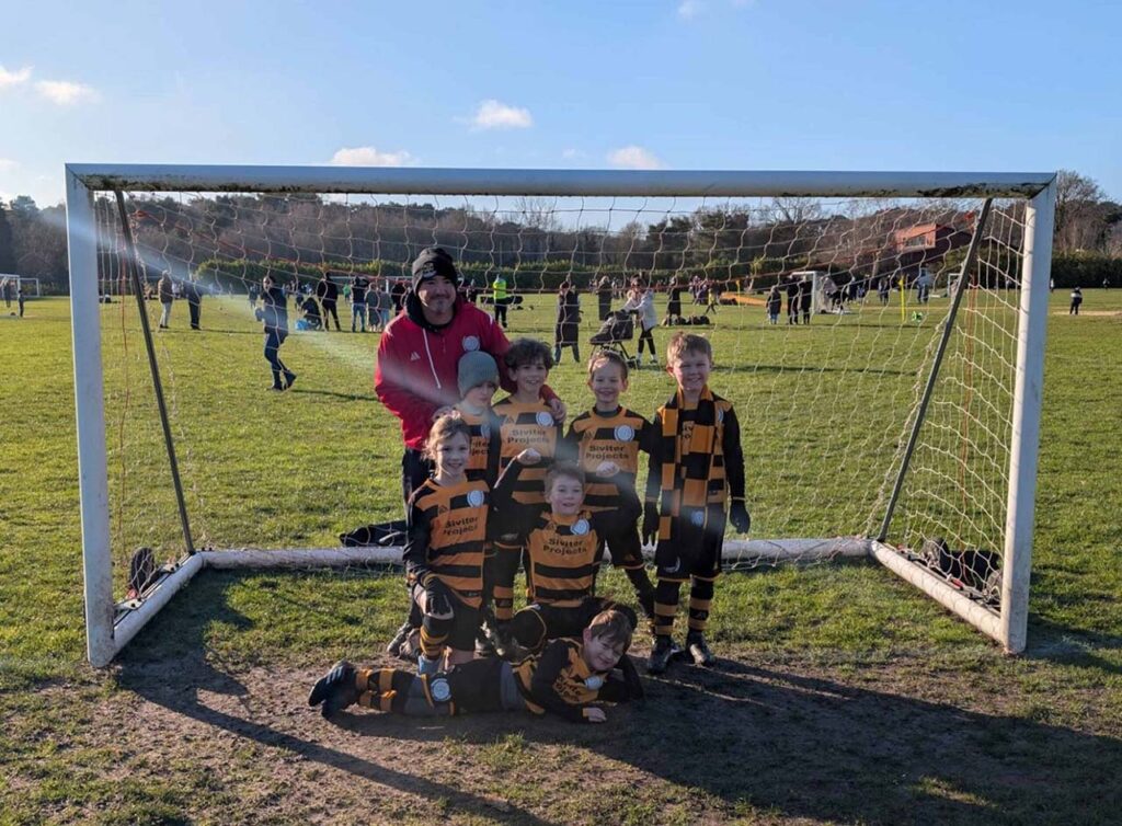 Curley Park Rangers U8 Thunder team photo at goalpost 2025