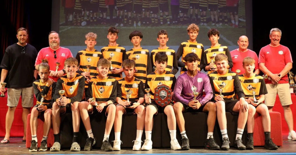 Under-14 Tigers Division 2 Champions 2025 team photo with awards